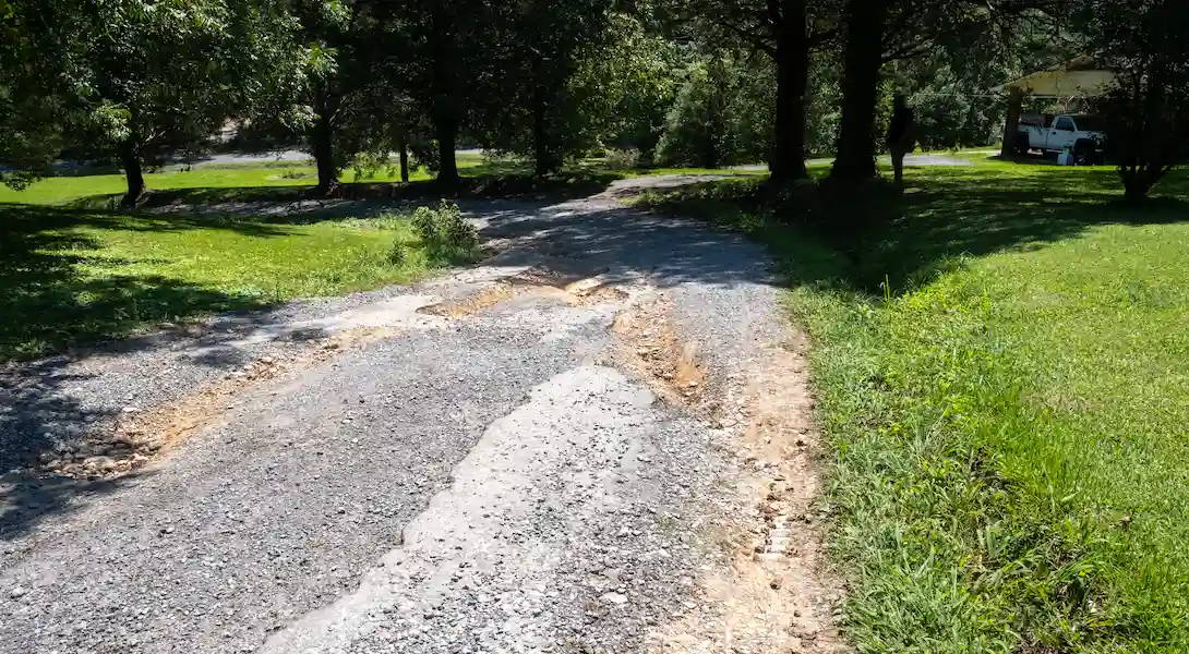 gravel road repair in New Hope, condition before
